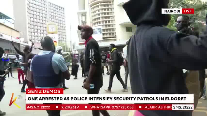 Nairobi: Police officers drop teargas canisters at protesters singing the national anthem