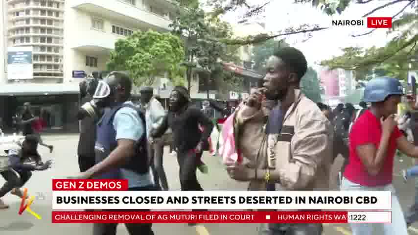 Nairobi: Police officers drop teargas canisters at protesters singing the national anthem