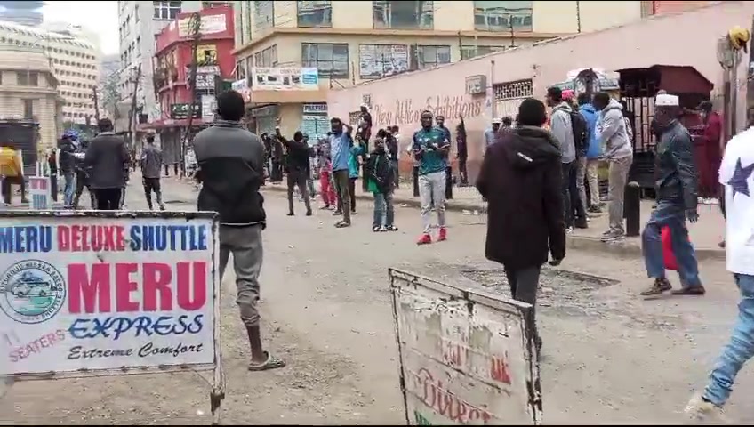 Protesters voices rising in song as they lament the failures of the current leadership. Their chants echo a deep sense of frustration with the present administration, highlighting the issues they believe have been neglected or mishandled