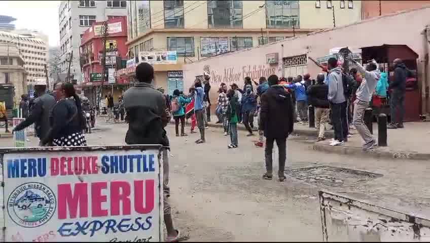 Protesters voices rising in song as they lament the failures of the current leadership. Their chants echo a deep sense of frustration with the present administration, highlighting the issues they believe have been neglected or mishandled