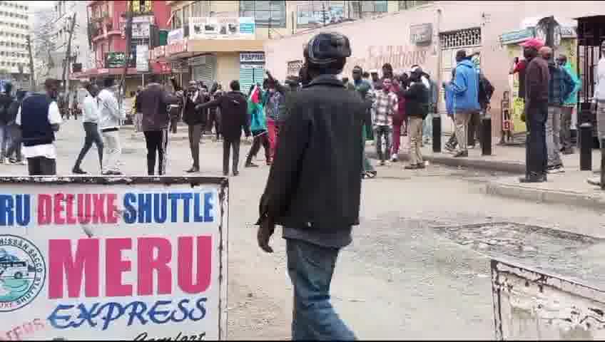 Protesters voices rising in song as they lament the failures of the current leadership. Their chants echo a deep sense of frustration with the present administration, highlighting the issues they believe have been neglected or mishandled